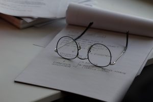 glasses resting on a piece of paper